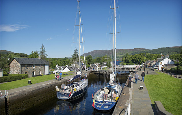 two yachts in a lock on a canal in Scotland. From next year, CO alarms will need to be fitted onboard
